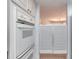 Kitchen featuring modern appliances and a glimpse of the dining area through classic swinging doors at 1 John Anderson Dr # 3170, Ormond Beach, FL 32176