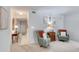 Cozy living area showing neutral carpeting with comfortable seating and hallway to entry at 1 John Anderson Dr # 3170, Ormond Beach, FL 32176