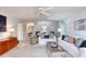 Bright and airy living room with comfortable white sofas, stylish decor, and a ceiling fan at 1 John Anderson Dr # 3170, Ormond Beach, FL 32176