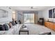The living room offers neutral tones, balcony access, and plenty of seating at 1 John Anderson Dr # 3170, Ormond Beach, FL 32176
