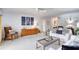 Cozy living room with comfortable sofas, stylish decor, a ceiling fan and a light-colored carpet at 1 John Anderson Dr # 3170, Ormond Beach, FL 32176