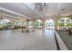 Spacious lobby with elegant chandeliers, arched windows, and seating areas for relaxing and socializing at 1 John Anderson Dr # 3170, Ormond Beach, FL 32176