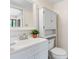 Cozy bathroom featuring a stylish vanity with cabinet storage, a well-lit mirror, and a toilet at 101 N Hill Ave # 6, Deland, FL 32724