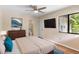 Inviting bedroom with a ceiling fan, ample natural light, and en suite bathroom at 101 N Hill Ave # 6, Deland, FL 32724