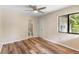 Bedroom with a ceiling fan, ample natural light, and an en suite bathroom at 101 N Hill Ave # 6, Deland, FL 32724