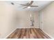 Bright bedroom with a ceiling fan and modern flooring, leading to the en suite bathroom at 101 N Hill Ave # 6, Deland, FL 32724