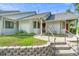 Charming one-story home features inviting entrance with well-kept lawn and decorative stone retaining wall at 101 N Hill Ave # 6, Deland, FL 32724