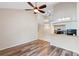 Bright living room with modern flooring leading to the kitchen area at 101 N Hill Ave # 6, Deland, FL 32724