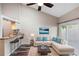 Bright living room featuring a comfortable sectional sofa and a stylish bar area at 101 N Hill Ave # 6, Deland, FL 32724
