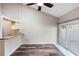 Open-concept living room with modern flooring and sliding glass doors for natural light at 101 N Hill Ave # 6, Deland, FL 32724