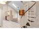 Bright living room with spiral staircase, skylight, and updated kitchen at 101 N Hill Ave # 6, Deland, FL 32724