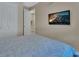 Bedroom with closet and wall-mounted television at 1018 River Falls Cir, Deland, FL 32720