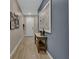 Welcoming entryway with neutral colors, stylish decor, and light wood-look tile flooring at 1018 River Falls Cir, Deland, FL 32720