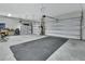 Bright and spacious garage with overhead door and epoxy flooring offers lots of space at 1018 River Falls Cir, Deland, FL 32720