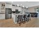 Bright kitchen features granite countertops, a stylish island, and stainless steel appliances at 1018 River Falls Cir, Deland, FL 32720