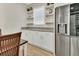 Kitchen features granite countertops, stainless steel appliances, and white cabinets at 1018 River Falls Cir, Deland, FL 32720