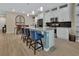 Bright kitchen features granite countertops, a stylish island, and stainless steel appliances at 1018 River Falls Cir, Deland, FL 32720