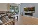 Comfortable living room with a large sliding glass door and view of outdoor patio at 1018 River Falls Cir, Deland, FL 32720