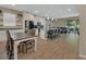 Bright and open living area featuring a kitchen island and dining room at 1018 River Falls Cir, Deland, FL 32720