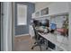 Well-lit home office with built-in desk and cabinets at 1018 River Falls Cir, Deland, FL 32720