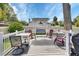 Backyard deck featuring comfortable outdoor seating, a grill, and picturesque scenery at 1020 N Orange Ave, Orange City, FL 32763