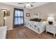 Bedroom with wood floors, a daybed, and large window providing natural light at 1020 N Orange Ave, Orange City, FL 32763