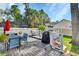 Outdoor deck featuring patio furniture, a grill, and a landscaped backyard at 1020 N Orange Ave, Orange City, FL 32763