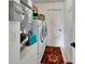 Laundry room featuring a washer, dryer, and storage space for cleaning supplies at 1020 N Orange Ave, Orange City, FL 32763