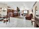 Open concept living area with fireplace, bar seating, tile and wood flooring at 1020 N Orange Ave, Orange City, FL 32763