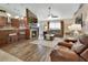 Spacious living room featuring a fireplace, bar seating, and comfortable sofas at 1020 N Orange Ave, Orange City, FL 32763