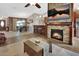 Open living area featuring a fireplace, bar, and open view to dining room at 1020 N Orange Ave, Orange City, FL 32763
