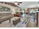 Bright, open-concept living space with hardwood floors and fireplace at 1020 N Orange Ave, Orange City, FL 32763