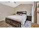 Comfortable main bedroom featuring a decorative accent wall, natural light, and hardwood floors at 1020 N Orange Ave, Orange City, FL 32763