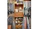 Walk-in closet featuring custom wood shelving for shoes and clothes at 1020 N Orange Ave, Orange City, FL 32763
