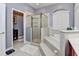 Bathroom featuring a step-up tub, glass enclosed shower, and tile flooring at 1020 Orange Camp Rd, Deland, FL 32724