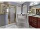Bright bathroom showcasing a luxurious soaking tub, separate shower, and elegant fixtures at 1020 Orange Camp Rd, Deland, FL 32724