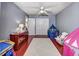 Well-lit bedroom with hardwood floors, a white rug, and closet at 1020 Orange Camp Rd, Deland, FL 32724