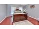 Primary bedroom with wood floors, neutral paint, a large bed, and two windows at 1020 Orange Camp Rd, Deland, FL 32724
