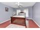 Clean bedroom featuring cherry floors, a large bed, and windows at 1020 Orange Camp Rd, Deland, FL 32724