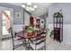 Inviting dining room with hardwood floors, natural light, and an open layout to the kitchen at 1020 Orange Camp Rd, Deland, FL 32724