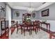 A formal dining room features elegant furniture and a chandelier at 1020 Orange Camp Rd, Deland, FL 32724