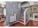 Entryway featuring hardwood floors, stairs to the upper level, and chandelier at 1020 Orange Camp Rd, Deland, FL 32724