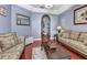 Cozy living room with comfortable seating, hardwood floors, and decorative table at 1020 Orange Camp Rd, Deland, FL 32724