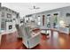 Open concept living room with hardwood floors and views of the backyard pool at 1020 Orange Camp Rd, Deland, FL 32724