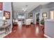 Sunlit living room with hardwood floors, neutral paint, and access to a patio at 1020 Orange Camp Rd, Deland, FL 32724