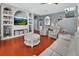 Spacious living room with custom built-ins, modern furniture, and bright, open design at 1020 Orange Camp Rd, Deland, FL 32724
