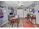 Home office with wood floors, a ceiling fan, and a desk area with ample storage at 1020 Orange Camp Rd, Deland, FL 32724