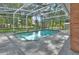 A backyard pool view features a well-kept lawn and mature trees at 1020 Orange Camp Rd, Deland, FL 32724