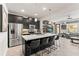 Modern kitchen with stainless steel appliances, a large island, and an open concept design at 10460 Burrows St, Orlando, FL 32832