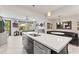 Bright kitchen with white countertops, stainless appliances, and an open flow to the living area at 10460 Burrows St, Orlando, FL 32832